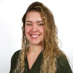 Carli Simkins, a dental hygienist at NHC Tanasbourne Medical and Dental Clinic, smiles at the camera