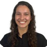 Talia Staiger, a family dentist, at NHC Tanasbourne Medical and Dental Clinic, smiles at the camera