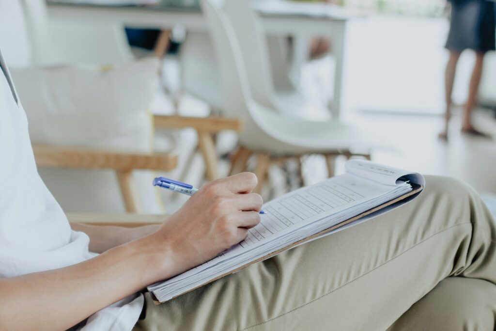 a person filling out a whole health care screening form