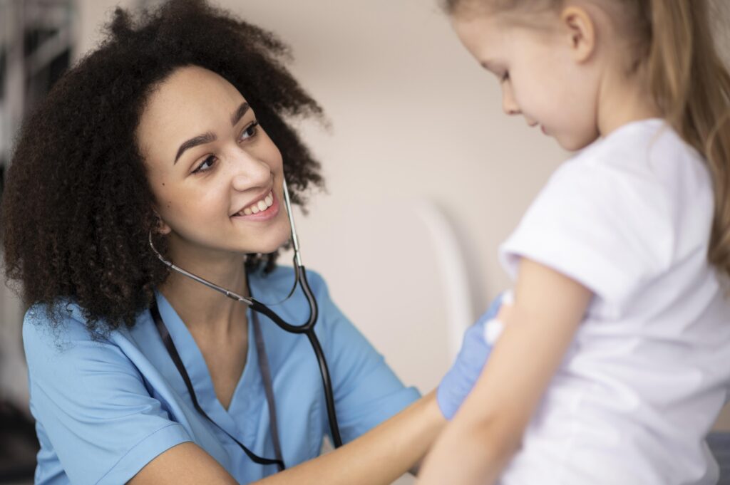a primary care provider checking the heartbeat on their patient
