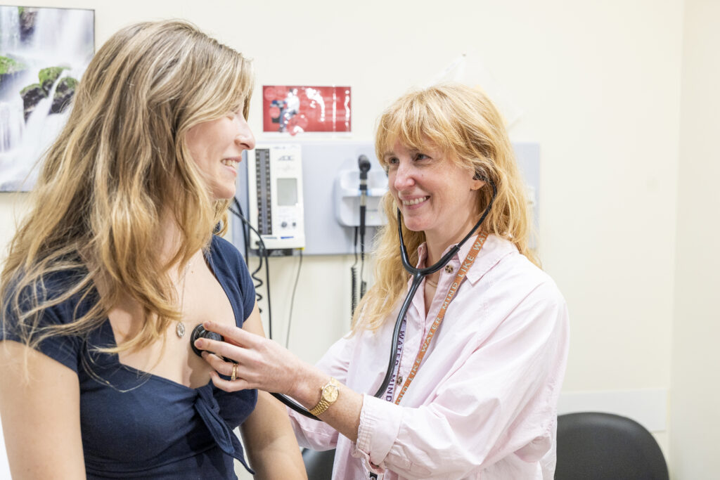 a pcp checking a patient's heartbeat with their stethoscope