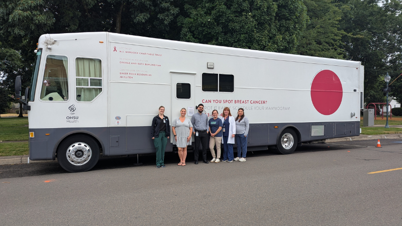 a group of healthcare providers standing in front of OHSU's Mamm Van