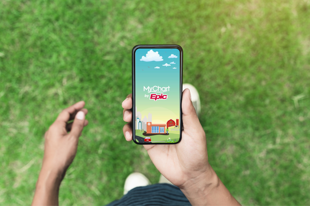 hands holding a phone that has mychart on it