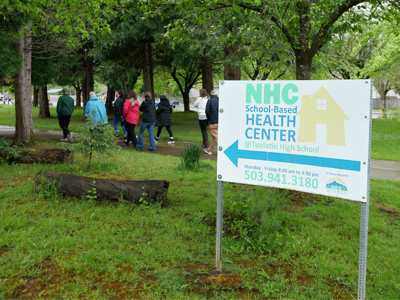 a sign pointing to where the school-based health center is located