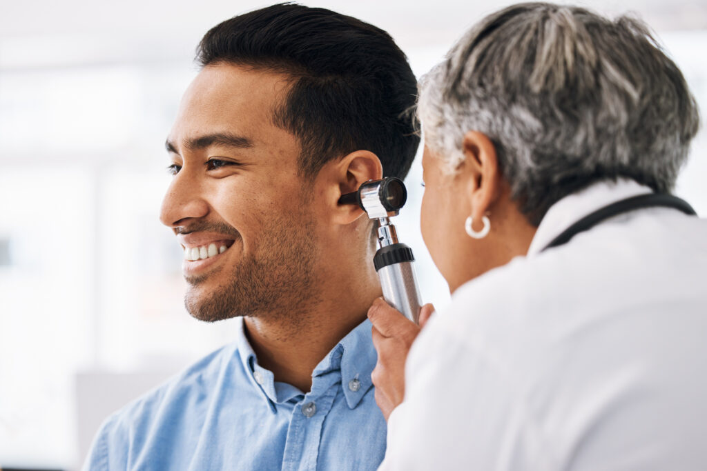 doctor checking a patient's ear