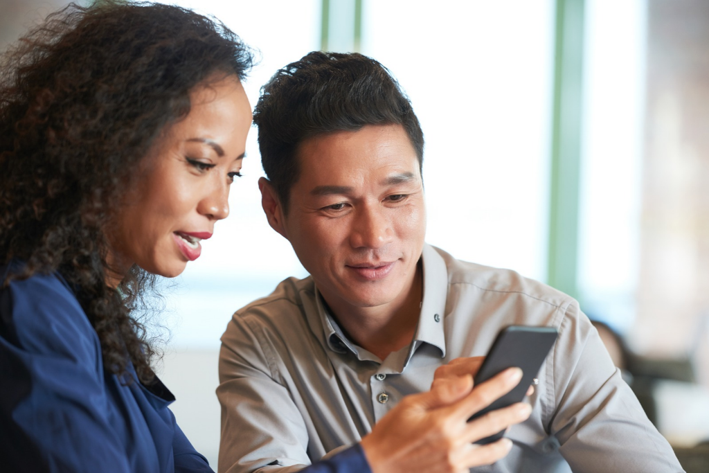 a woman and man looking at mychart on their phone